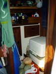 The honey pot and durable produce storage. The blue bag on the wall is 6 months of teepee (we hope, its spendy to non-existent in the south pacific). The toilet is a pac-a-potty so we have to empty it out about once a week. Magical!