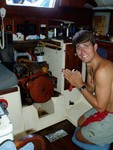 Praying over the beast that won�t quit, the gasoline Atomic-4 engine that�s older than we are. Ideally we would have a diesel, so we sail more than we motor. Neatly tucked away underneath the stairs. (Disregard the dark stains, it�s old, okay?) 
