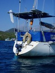 The transom. That�s the windvane used to automatically steer the boat without using electricity. The orange thing is the man overboard pole next to our power station-3 solar panels and wind generator. 