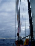 Dousing the spinnaker before a squall up ahead. The tube is a spinnaker sock which will encapsulate the spinnaker at a moment's notice making it really easy to handle these monster sails.