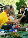 Making tapa, a bark cloth material used for clothing and art. 