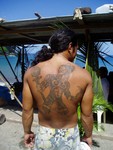 Tattoo of a haka, a Marquesan warrior. They used to kill their enemies with intricately-carved wooden clubs. Polynesia is a heavily-tattooed culture.