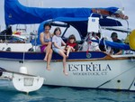 Estrela, Kyle and Doug were out sailing around the world with their daughter's Abigail and Eliza, 6 and 9. They wanted to spend time with their children before Britney Spears and Coca-cola corrupted them. They are some of our favorite people we have met cruising.