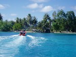 Mana's skiff going to his parent's house. About half of his siblings live in Tahiti or Moorea.