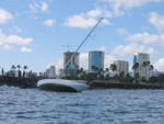 Ouch. This happened in the Ala Wai harbor channel. Although made of steel, it was left on the rocks for several days and eventually broke up into pieces.