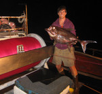 Monchong, a deep-water fish. The boats fished at night and caught some strange beasts as a result.John is standing next to the level wind reel that retrieves 30 miles of monofilament every night on this 55 ft. 50 year old wooden boat. Great assighnment!