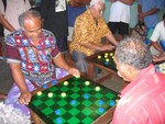 Hot game of checkers in the market.